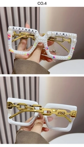 Detail of square party glasses with pearls, birthday girl text and gold chain arms