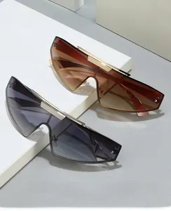 Detail of rimless punk sunglasses with metallic top bar and gradient shield lenses