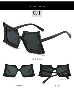 Detail view of oversized square sunglasses with black geometric frame and silver studs