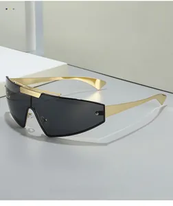 Detailed macro view of the punk tech-inspired sunglasses with golden metallic frame detail