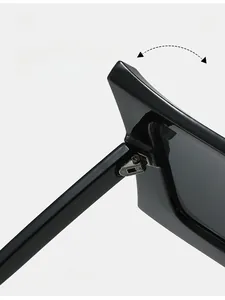 Macro shot of durable metal hinges on oversized square black frame sunglasses