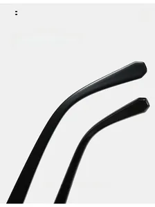 Detailed macro view of ergonomic curved black temple legs on square hip-hop sunglasses