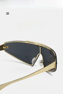Detail of gold metal frame sunglasses with wide temples and comfortable nose pads