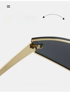 Close-up of durable metal hinge and sleek gold temple on punk style wrap sunglasses
