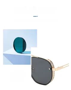 Steampunk sunglasses detail featuring gold hollow mesh side shields and dark gray lenses