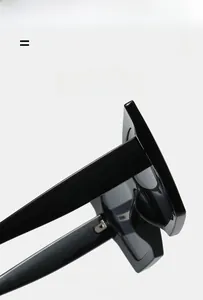 Detail view of large cat-eye sunglasses hinges showing lightweight and elastic texture