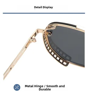 Detail view of durable gold metal hinges on steampunk sunglasses with dark gray lenses