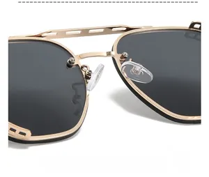 Detail of adjustable silicone nose pads on gold steampunk sunglasses for comfort