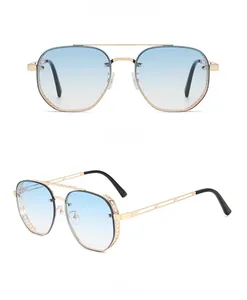 Steampunk gold metal aviator sunglasses with blue gradient lenses and hollow temple design