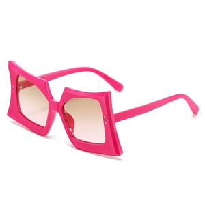 Oversize square sunglasses with pink frames and gradient lenses in a 45-degree view