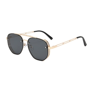 Steampunk sunglasses with gold metal frames and unique side shields on a white background