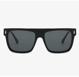 Close-up of black flat top square sunglasses with decorative silver metal shield studs