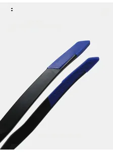 Detail of curved sunglasses arms with black finish and blue anti-slip honeycomb texture