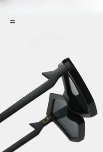 Detail of durable hinges on black polygonal sunglasses with lightweight elastic frames