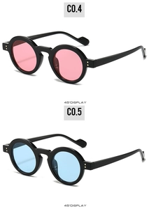 45-degree angle of retro round sunglasses with pink and blue lenses and metal rivets