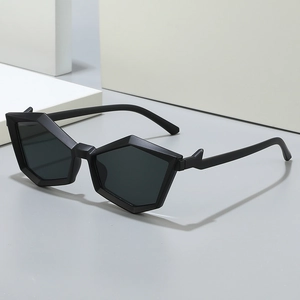 Modern black polygon sunglasses with geometric frames and dark lenses on a minimalist background