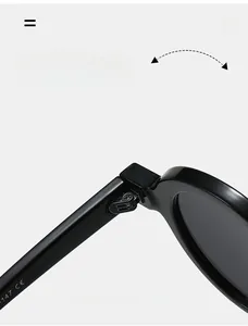 Detail view of durable metal hinges and size marking on black round frame sunglasses