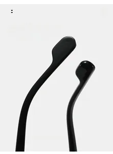 Detail shot of the curved ergonomic temple tips on vintage small round sunglasses