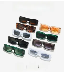 Flat lay of retro rectangle sunglasses in diverse candy colors on white background