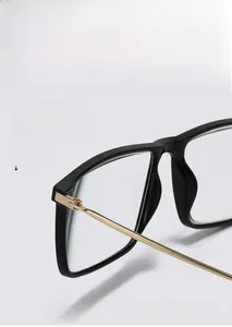 Detailed view of durable hinge structure and slim gold metal legs on black square glasses