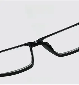 Detailed macro view of the comfortable integrated nose pads on glossy black glasses