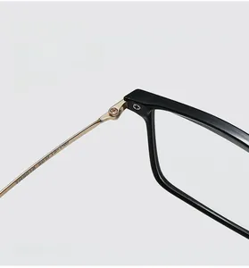 Close-up of golden metal hinge and TR9018 specs on black square glasses frame