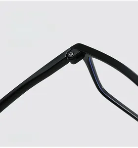 Detail of sturdy metal hinge with silver screws on black TR90 reading glasses frame