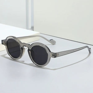 Retro small round frame sunglasses in translucent grey resin with UV protection