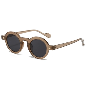 Vintage round sunglasses with translucent amber frames and dark grey UV lenses
