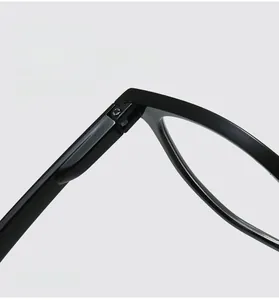 Detail view of durable metal spring hinges on retro oval frame reading glasses
