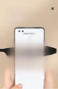 Macro shot showing blue light blocking reading glasses clarifying text on a mobile phone