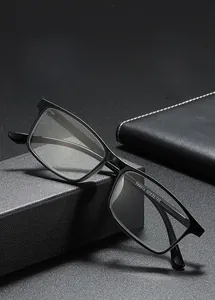 Detail shot of black TR90 square frame glasses with size specs on textured surface