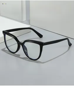 Macro detail of black thick-frame cat-eye glasses with anti-blue light lens finish