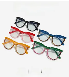 Flat lay of stylish oversized blue light glasses in various colors and patterns