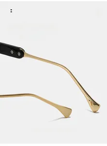Detailed macro view of ergonomic curved gold metal temple and hinge on round glasses