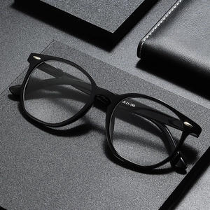 Classic oval black full-rim reading glasses with silver metal rivets and spring hinges