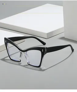 Close-up of black cat-eye glasses frame with rivet details and contrast inner rim