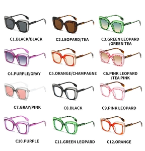 Matrix display of twelve colorful square frame sunglasses with geometric hollow temples