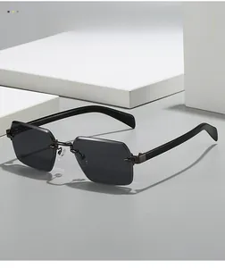 Detail view of grey rimless hexagonal lenses with sleek black temples and metal bridge