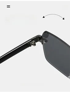 Detailed close-up of durable metal hinge with screw fixation on rimless sunglasses