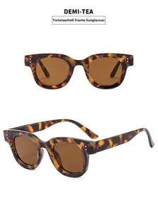 Detail view of oval tortoise shell sunglasses with tea lenses and silver rivets