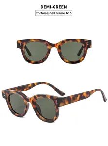 Macro detail of oval demi-green tortoiseshell sunglasses with silver rivets and G15 lenses