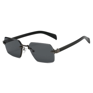 Modern rimless hexagonal sunglasses with dark grey lenses and black temples on white background