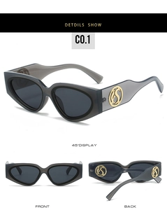 Detail of gray translucent cat-eye sunglasses with gold S logo on the wide temples