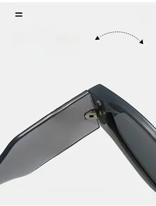 Detail of durable metal hinges and round hollow metal decoration on grey cat eye sunglasses