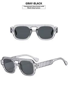 Detail of transparent gray frame sunglasses with vertical stripes and black gray lenses