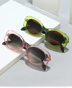 Detail of 2024 retro oval sunglasses in purple and green acetate with gradient lenses
