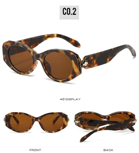 Three-angle view of oval tortoiseshell sunglasses with gold metal snake head temple detail