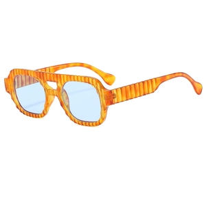 Retro aviator sunglasses with amber striped frames and light blue lenses in a 45-degree view
