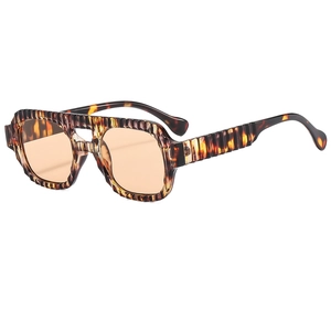 Vintage double-bridge tortoiseshell sunglasses with vertical stripes and orange lenses